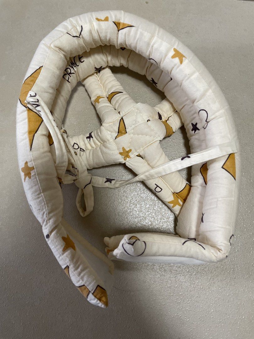 Baby Crawling Safety Helmet (Category: Infant Playtime) located in Quezon City. Submitted by declutter-jen (Listing ID 1451264516, Image 3). Description: - Protects baby's head during crawling and walking - Soft padding cushions against bumps and falls - Adjustable straps ensure a secure and comfortable fit - Features a cute, fun print for babies - Ideal for indoor play and exploration.