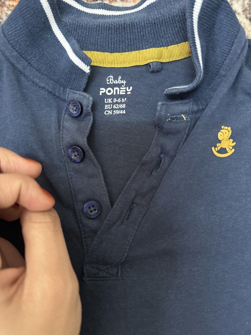 Baby Poney Navy Blue Polo Romper 6-9 Months (Category: Babies & Kids Fashion) located in Klang. Submitted by preloved_diya (Listing ID 1451220656, Image 2). Description: - Navy blue Baby Poney polo romper - Size: UK 6-9 months - Short sleeves with white trim - Cute rocking horse embroidery on chest - Button closure at neck - Snap buttons at crotch for easy diaper changes -add on postage Rm 9.