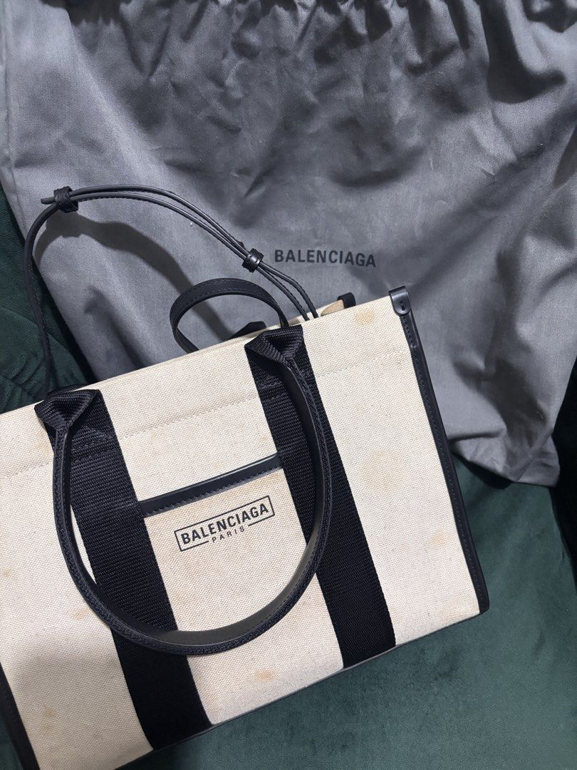 Balenciaga Canvas Tote (Category: Luxury Bags & Wallets) located in Quezon City. Submitted by jagab (Listing ID 1451258769, Image 1). Description: - AUTHENTIC Balenciaga tote bag - Material: Canvas and leather - Includes original dust bag - Needs cleaning - yellow Stains on both sides -still in very good condition!!.