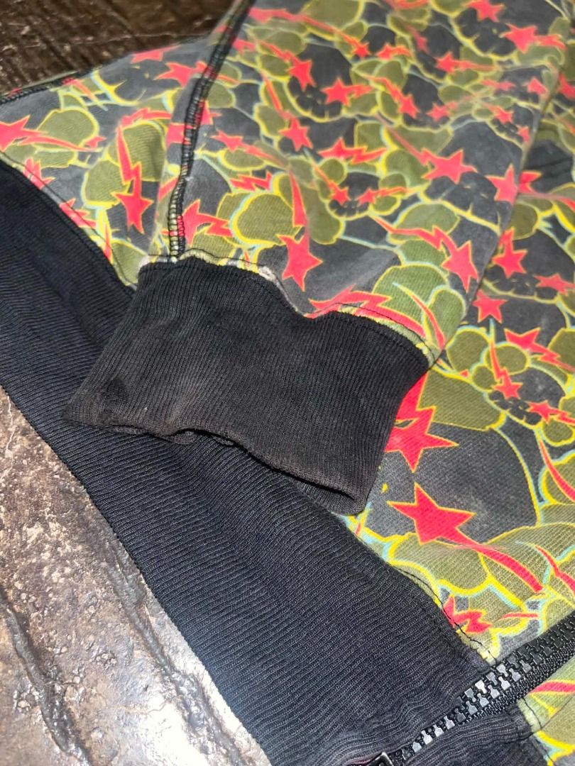BAPE x KAWS (20005) Full Zip Hoodie Camo Skull Star Pattern AUTHENTIC (Category: Coats, Jackets and Outerwear) located in Caloocan City. Submitted by zencrystal.aca8c6 (Listing ID 1451173195, Image 2). Description: - Authentic BAPE x KAWS full zip hoodie - Features iconic camo skull and star pattern all over - Black ribbed cuffs and hem for a clean look - Ideal for everyday casual wear - A unique statement piece for your wardrobe.