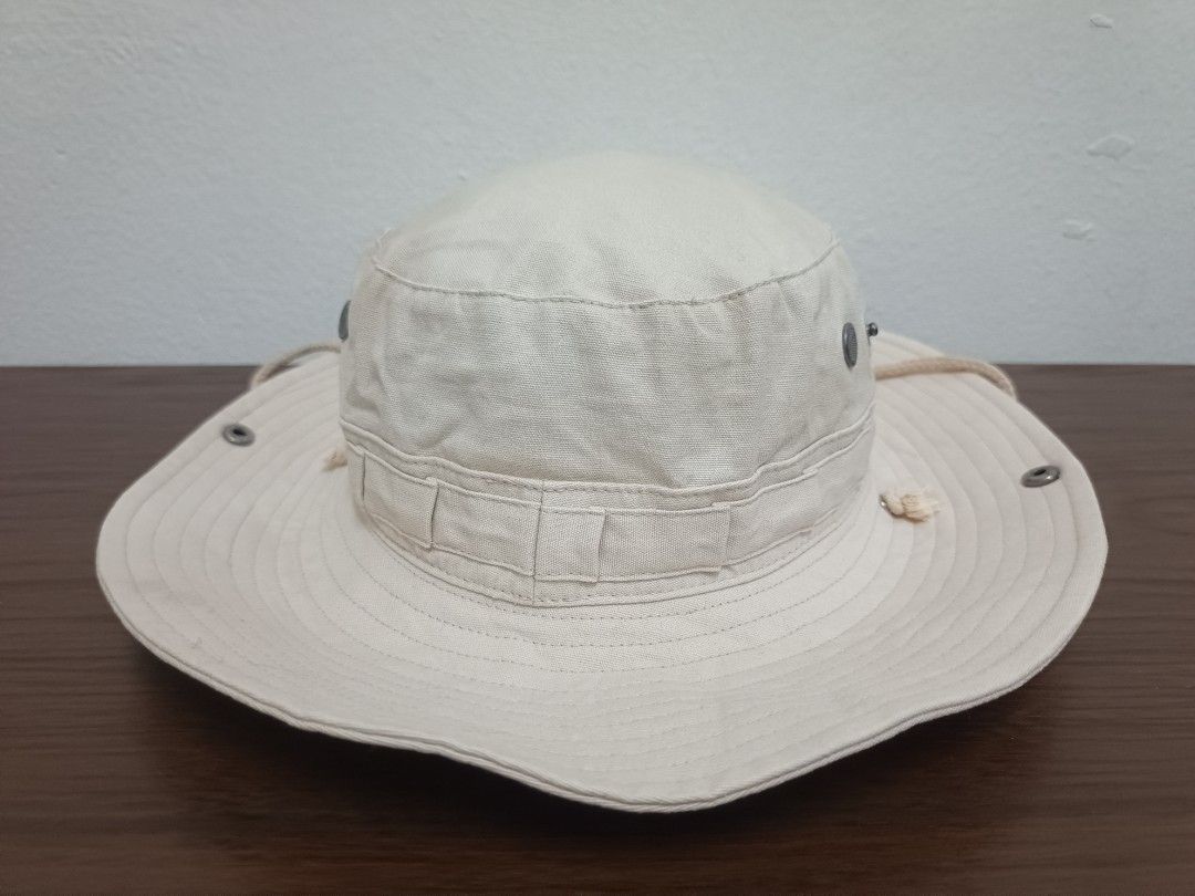Beige Bucket Hat with Black Swan Logo and Chin Strap (Category: Cap & Hats) located in Kuala Lumpur. Submitted by caphunterz33 (Listing ID 1451131952, Image 3). Description: - Stylish cool beige bucket hat - Features a chic black swan logo patch on the front - Adjustable chin strap for a secure and comfortable fit - Wide brim offers excellent sun protection - Ideal for all your outdoor activities - Designed with eyelets for ventilation.