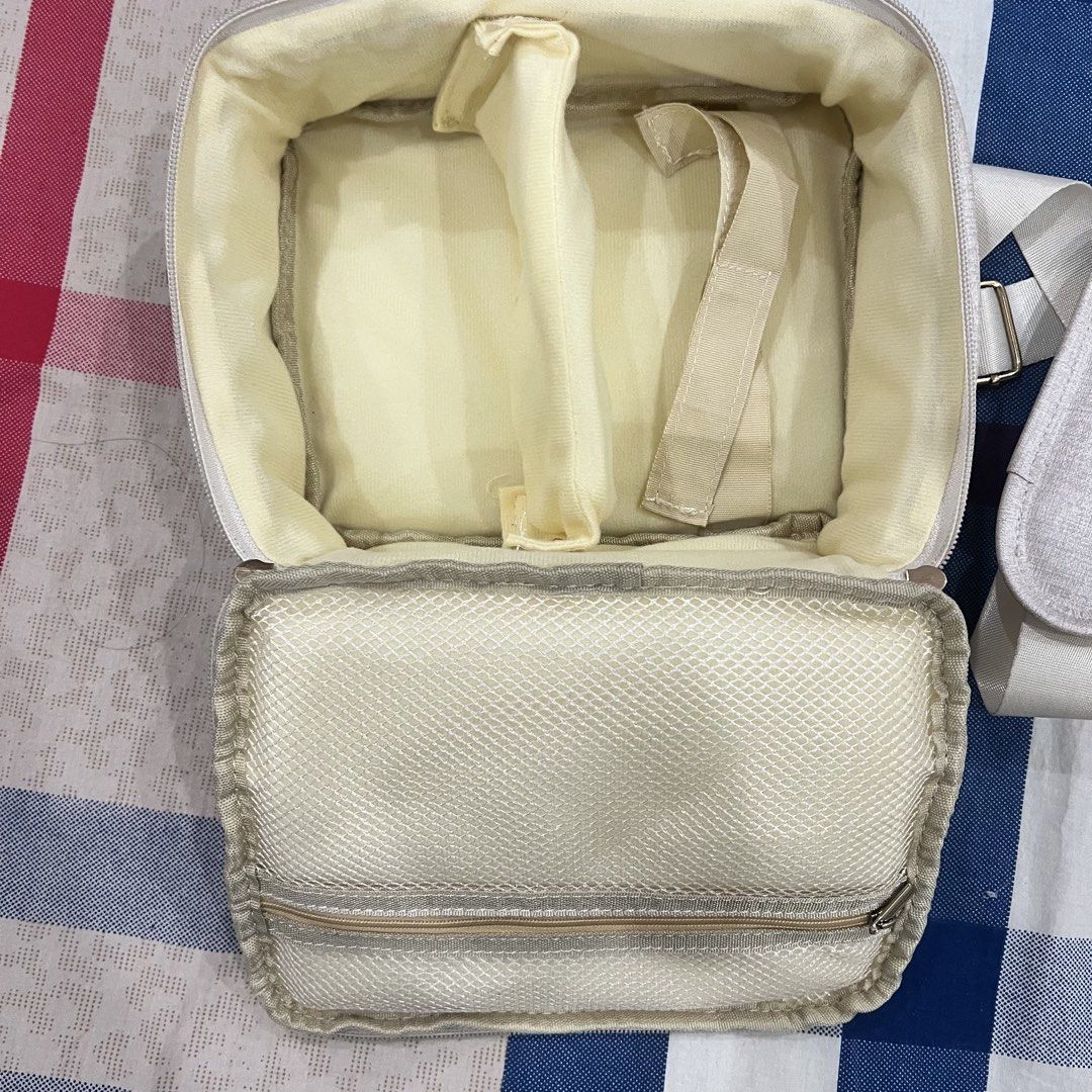 Beige/Ivory Camera Bag (Category: Purses & Pouches) located in Manila. Submitted by limonee (Listing ID 1451269872, Image 2). Description: No flaws aside from a few stains on the detachable strap and inner compartment .