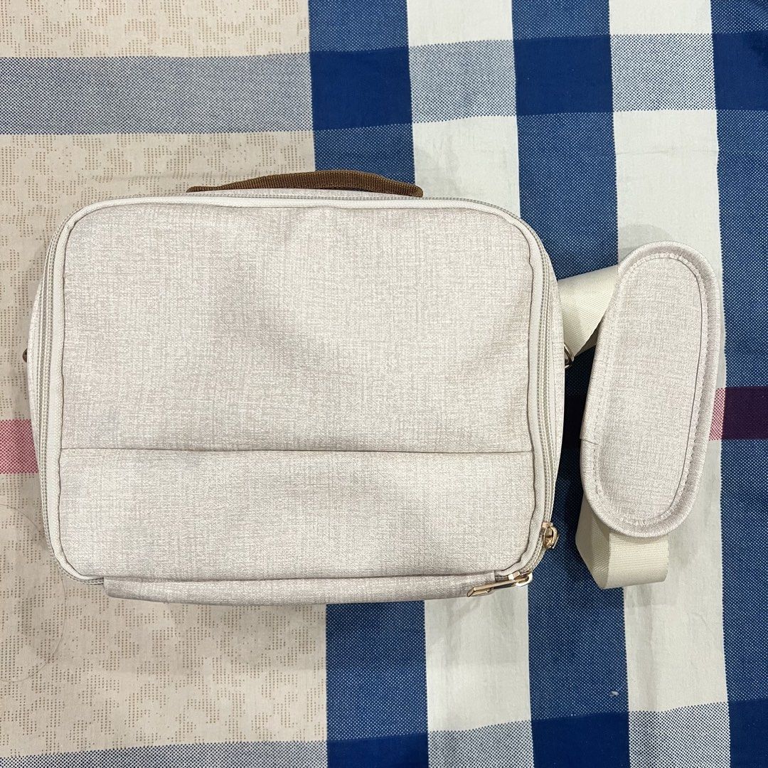 Beige/Ivory Camera Bag (Category: Purses & Pouches) located in Manila. Submitted by limonee (Listing ID 1451269872, Image 1). Description: No flaws aside from a few stains on the detachable strap and inner compartment .