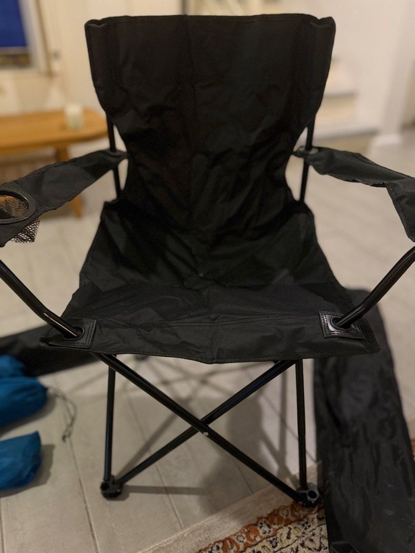 Black Folding Camping Chair with Cup Holder (Category: Chairs) located in Pasig City. Submitted by atticstreet (Listing ID 1451170793, Image 2). Description: * Portable folding chair * Black fabric seat and back * Built-in cup holder on armrest * Folds compactly for easy storage and transport * Comes with a black carrying bag * Ideal for camping, picnics, and backyard use.