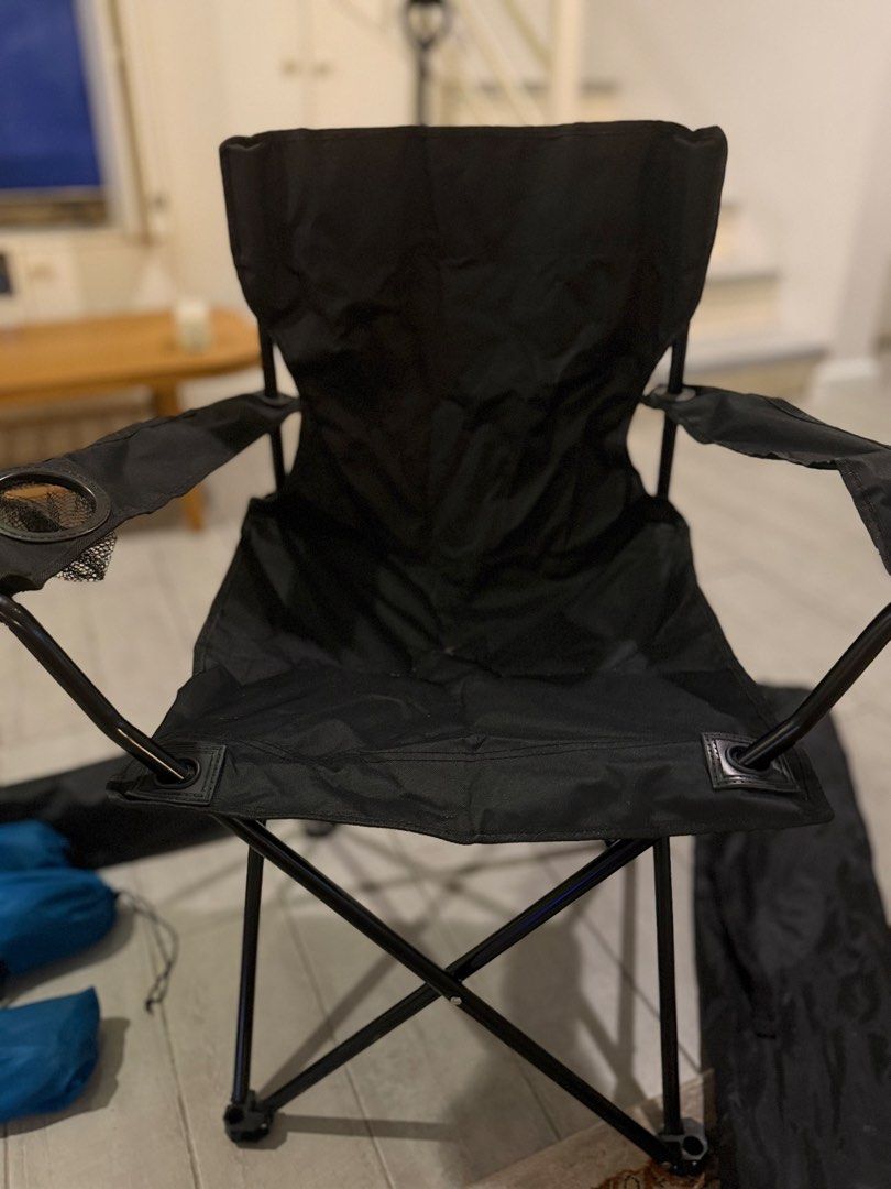 Black Folding Camping Chair with Cup Holder (Category: Chairs) located in Pasig City. Submitted by atticstreet (Listing ID 1451170793, Image 1). Description: * Portable folding chair * Black fabric seat and back * Built-in cup holder on armrest * Folds compactly for easy storage and transport * Comes with a black carrying bag * Ideal for camping, picnics, and backyard use.