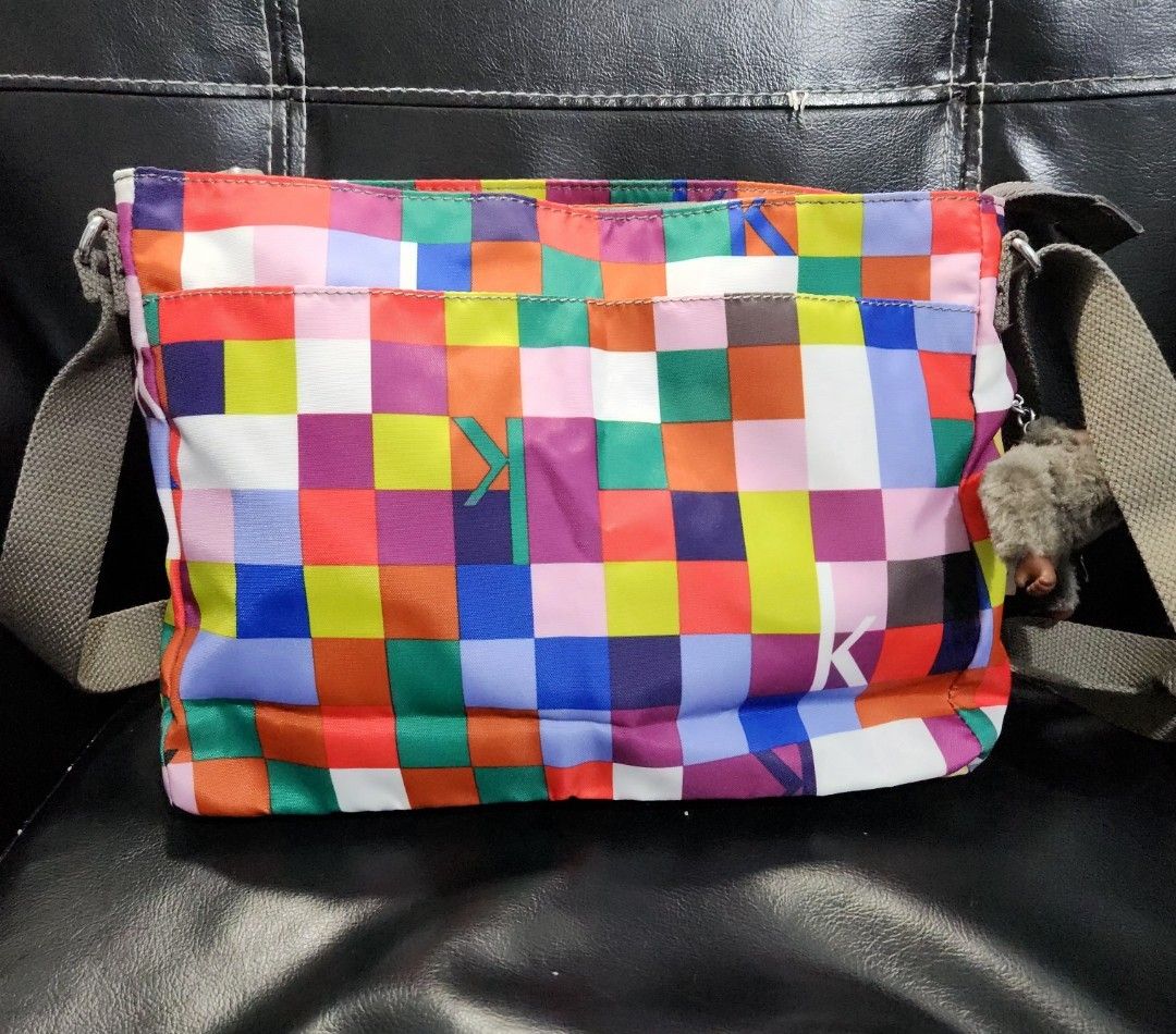 BNWT Kipling Coralie cross body bag (Category: Cross-body Bags) located in Quezon City. Submitted by ki_cai (Listing ID 1386190359, Image 2). Description: Brand New With Tag Kipling Bag Colorful checkered design Has been stored in the closet for years, never used Zippers are still smooth With 2 front pockets (zipper enclosure) 1 back pocket with magnetic enclosure Perfect for everyday use because of the pockets. No need for a bag organizer Flaw: 