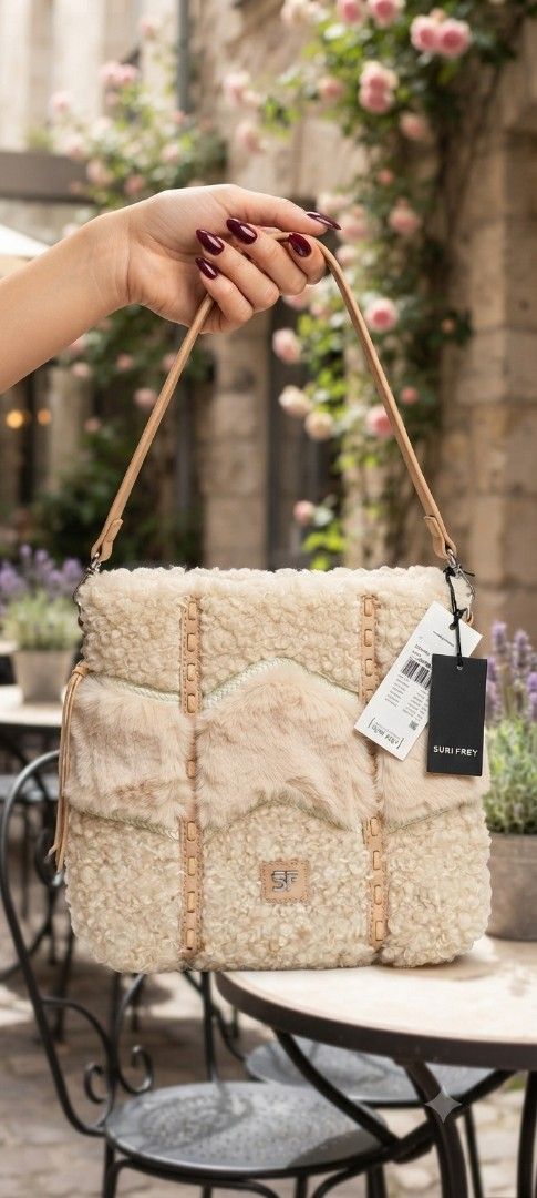 Brand new Fur Bag Cream (Category: Cross-body Bags) located in Cavite. Submitted by house_of_tabitha (Listing ID 1451155858, Image 1). Description: - Brand new cream shearling bag - Fluffy texture - Detachable strap included - Light tan leather accents - Features the SF logo in the center - Tags are still attached - super nice in actual.