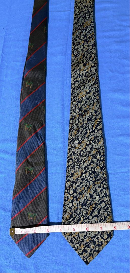 BUNDLE Lanvin Paris Silk Ties (2 pcs) (Category: Ties) located in Manila. Submitted by truedeclutter (Listing ID 1451193758, Image 1). Description: - Two authentic Lanvin Paris silk ties - One features blue and grey stripes with a green emblem - The other is dark blue with a floral pattern - Both ties are 100% silk - Versatile for formal or casual wear - Please check photos for detailed condition.