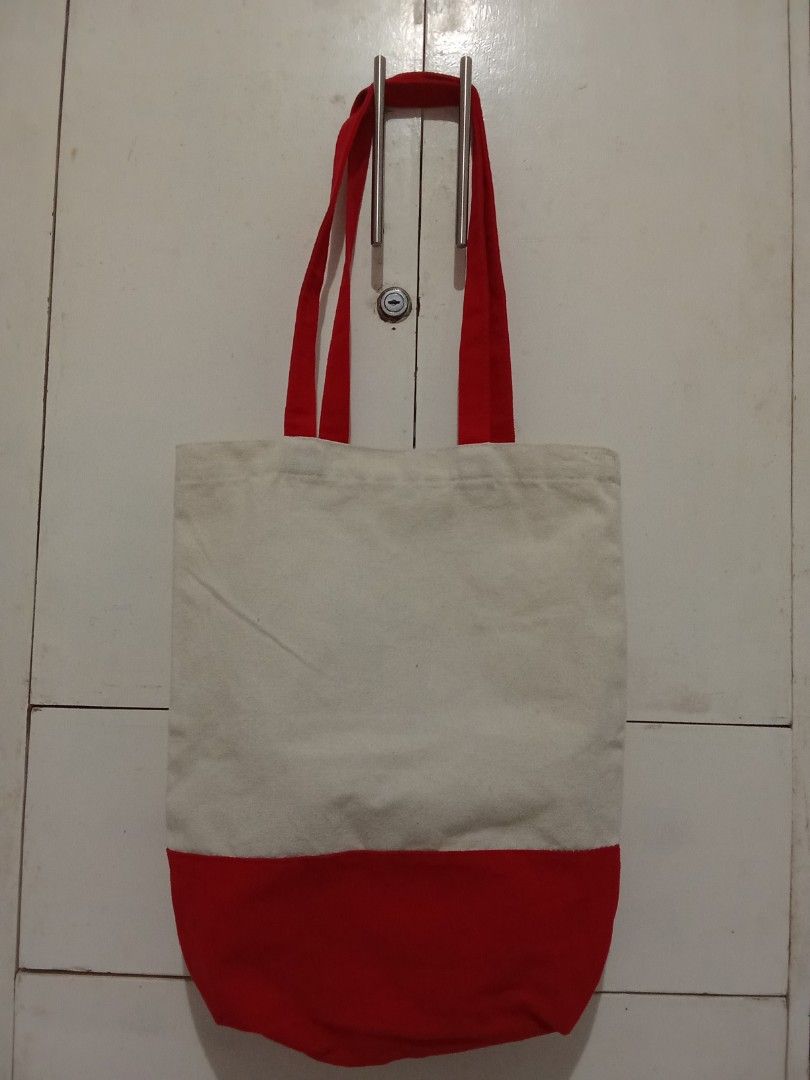 Canvas Tote Bag with Red Accents (Category: Tote Bags) located in Cavite. Submitted by jane019 (Listing ID 1451302322, Image 2). Description: - Simple and classic canvas tote bag - Features eye-catching red handles - Stylish red bottom panel for a pop of color - Red lining inside for a cohesive look - Ideal for everyday use and carrying essentials Pick up location: Cubao Quezon City or Sahud Ulan Tanza Cavite.