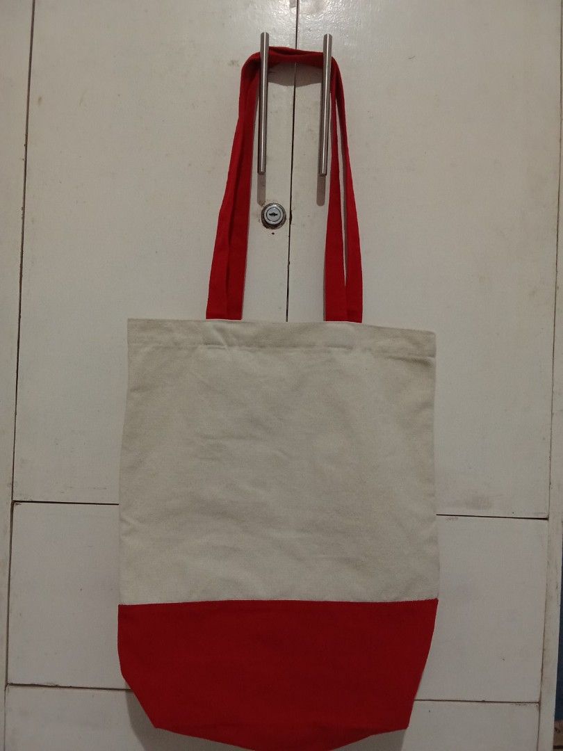 Canvas Tote Bag with Red Accents (Category: Tote Bags) located in Cavite. Submitted by jane019 (Listing ID 1451302322, Image 1). Description: - Simple and classic canvas tote bag - Features eye-catching red handles - Stylish red bottom panel for a pop of color - Red lining inside for a cohesive look - Ideal for everyday use and carrying essentials Pick up location: Cubao Quezon City or Sahud Ulan Tanza Cavite.