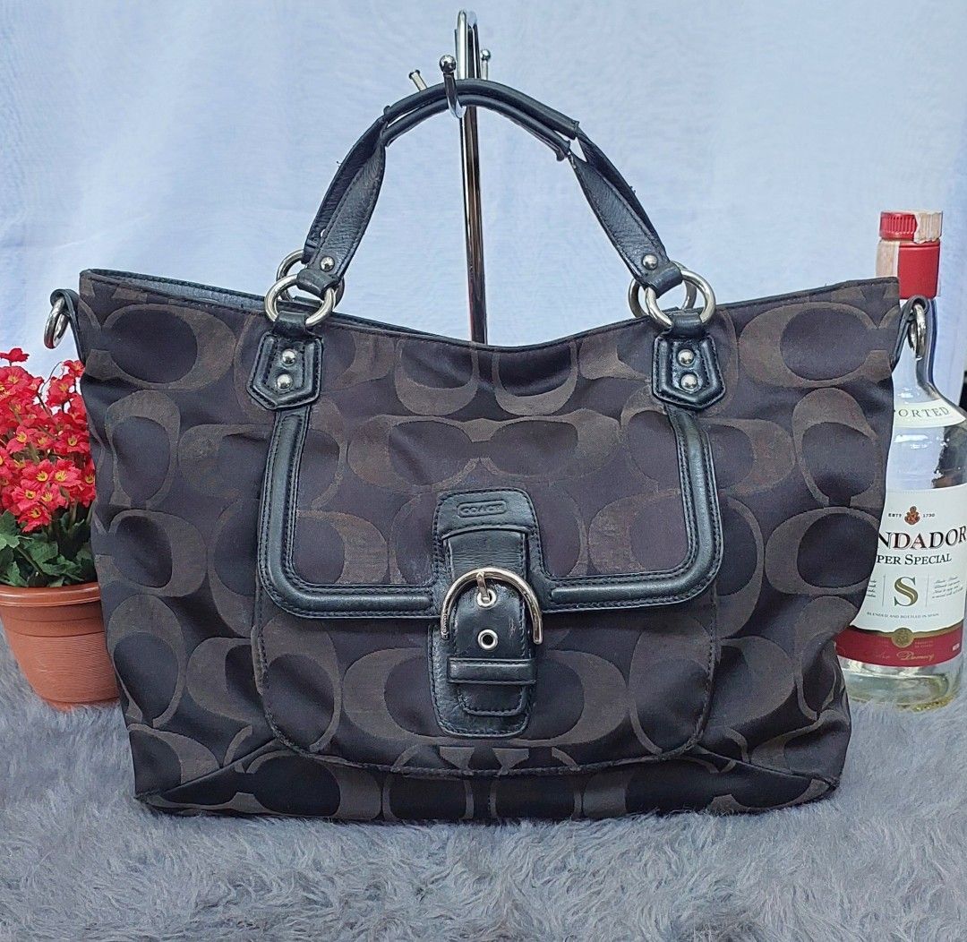 Coach Signature Monogram Tote Bag (Category: Luxury Bags & Wallets) located in Quezon City. Submitted by ruthie3 (Listing ID 1451179424, Image 1). Description: -issue no sling Classic Coach tote bag - Signature dark brown monogram pattern - Black leather trim and handles - Front flap pocket with buckle closure - Zippered main compartment - Interior leather creed patch with serial number - Perfect everyday bag.