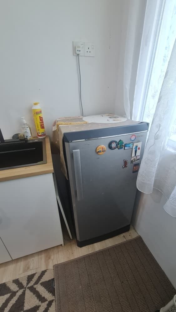 Compact Refrigerator (Category: Refrigerators & Freezers) located in Shah Alam. Submitted by syamaria (Listing ID 1451199801, Image 1). Description: - Compact fridge, ideal for dorm rooms or small kitchens. - Includes a freezer compartment. - Fully functional and working well. - Interior is clean and ready for use. - Exterior has some stickers on the front. - A great space-saving solution for your cooling needs..