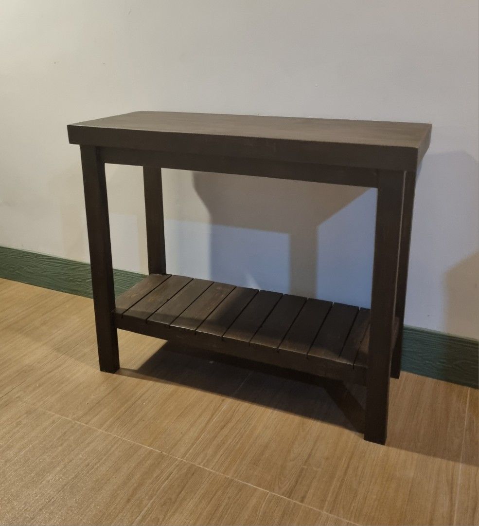 Console Table with Shelf (Category: Tables & Sets) located in Quezon City. Submitted by rusticwood8 (Listing ID 1451194396, Image 2). Description: - Elegant two-tier console table - Rich dark wood finish - Lower shelf features a stylish slatted design - Ideal for entryways, hallways, or living room accent - Built for sturdy and lasting use.