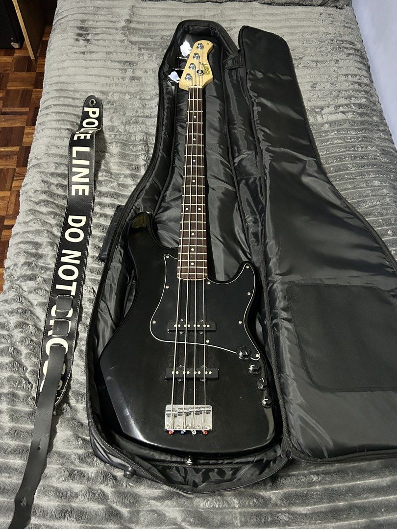 Cort GB34JJ Active 4 String Jazz Bass Guitar (Category: Musical Instruments) located in Manila. Submitted by jdelizo (Listing ID 1451314756, Image 1). Description: Hey! Selling this bass❗️ Condition is really good, no issues at all, reason for selling is need funds. No mods done to it either. Additional freebies: - Comes with free bag from Lazer - Black Police Guitar Strap as seen in photo above.