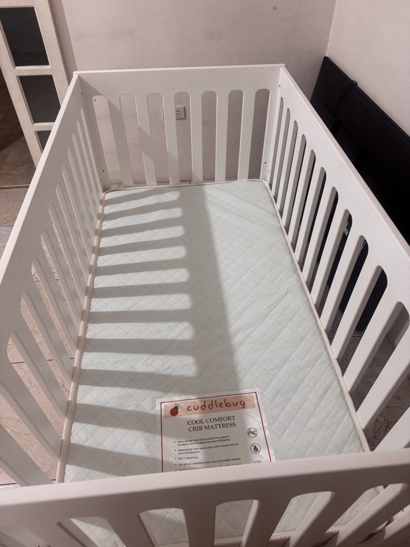 Cuddlebug Madison 3in1 Crib - Coffee (Category: Cots & Cribs) located in Bulacan. Submitted by _thriftlane (Listing ID 1451272755, Image 2). Description: - White crib with a sturdy brown base - Includes Cuddlebug Cool Comfort crib mattress - Mattress is clean and comes with a protective cover - Ready for its next loving home.