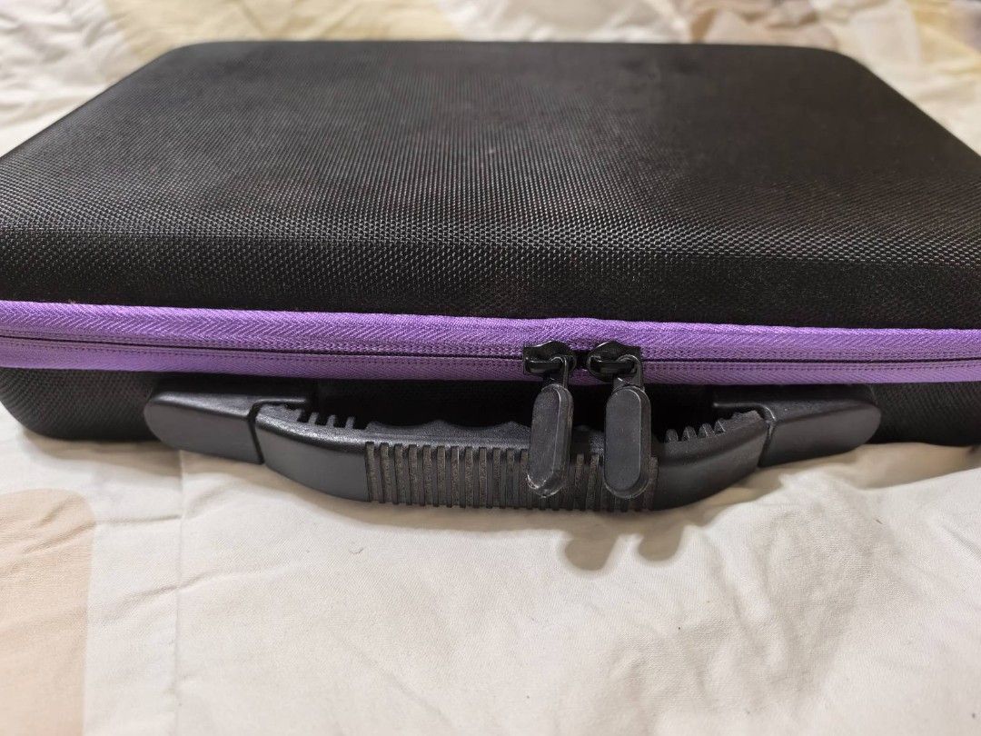 Diamond Painting Storage Case with Accessories (Category: Craft Supplies & Tools) located in Quezon City. Submitted by purple_chick (Listing ID 1451180217, Image 2). Description: - Black organizer case with purple trim and handle - Features many small clear containers for beads or gems - Comes with various tools like pens, a small blue eraser, and other accessories in sealed bags - Ideal for organizing diamond painting supplies.