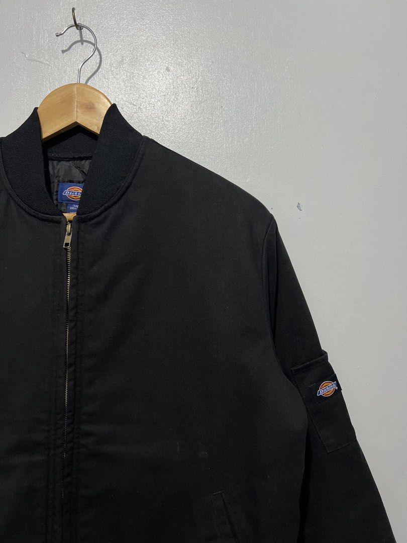 Dickies Black Bomber Jacket Medium (Category: Coats, Jackets and Outerwear) located in Baguio. Submitted by jakeflores1899-49462 (Listing ID 1451239886, Image 3). Description: - Classic black Dickies bomber jacket - Zip-up front closure - Ribbed cuffs and hem for a snug fit - Signature Dickies logo patch on the sleeve - Made in Vietnam - Ideal for everyday casual wear -Dimes:W23.5-L26.5 -Excellent Condition -minor issue ( white stain check last 3