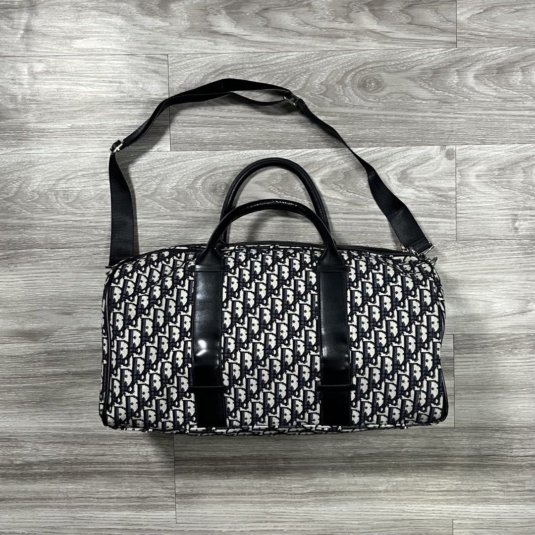 Dior Oblique Monogram Travel Bag (Category: Luxury Bags & Wallets) located in Cebu City. Submitted by specializedgoodsitem_ (Listing ID 1451227003, Image 2). Description: good as new no flaws details posted color may vary due to light 18.5’ width 9.5’ length .