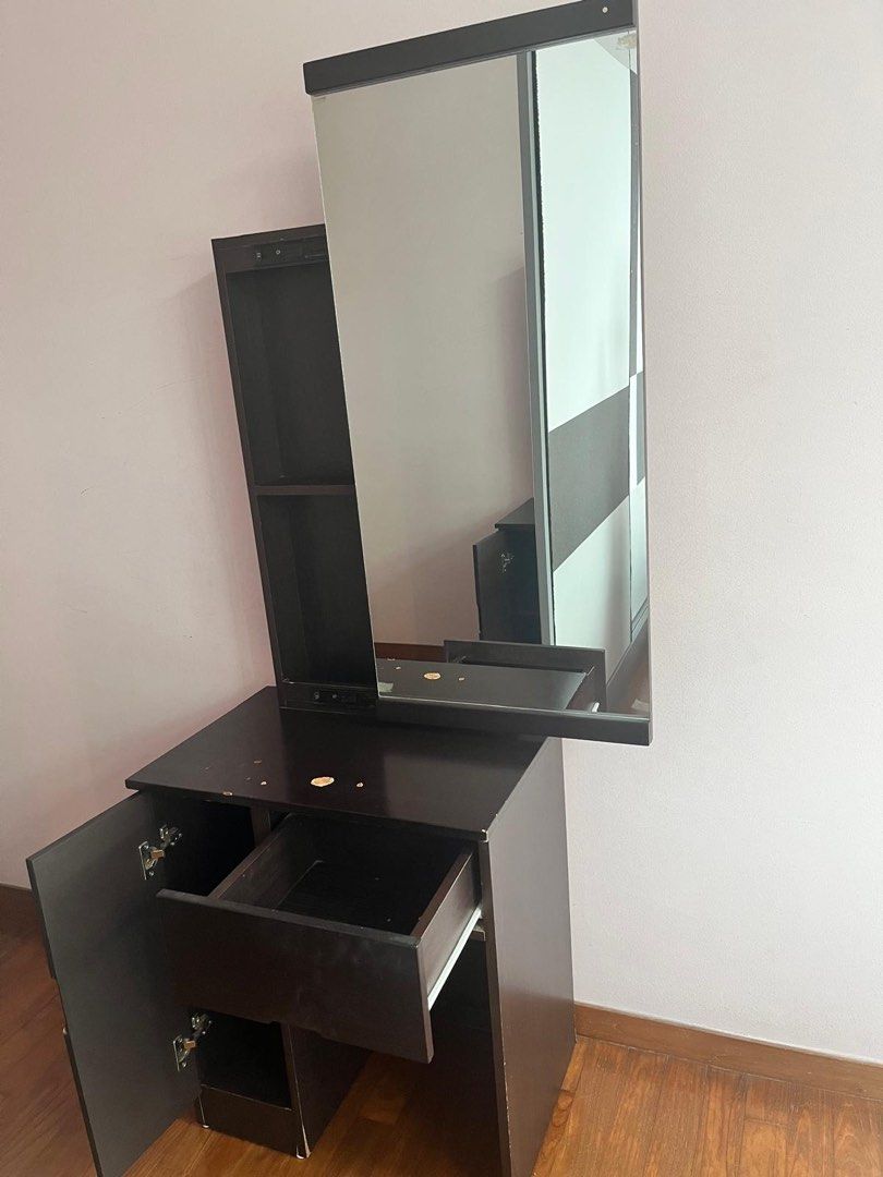 Dressing table (Category: Other Home Furniture) located in Singapore. Submitted by athakurd.11 (Listing ID 1451200994, Image 1). Description: Solid wood Dressing Table with Large Mirror – decent Condition Selling a sturdy dressing table with: * Large mirror * 1 smooth-glide drawer * 1 storage cabinet with shelf * Compact design – perfect for bedrooms and condos Condition: * Structurally solid. * Minor cosmetic wear (small chips/marks on the table
