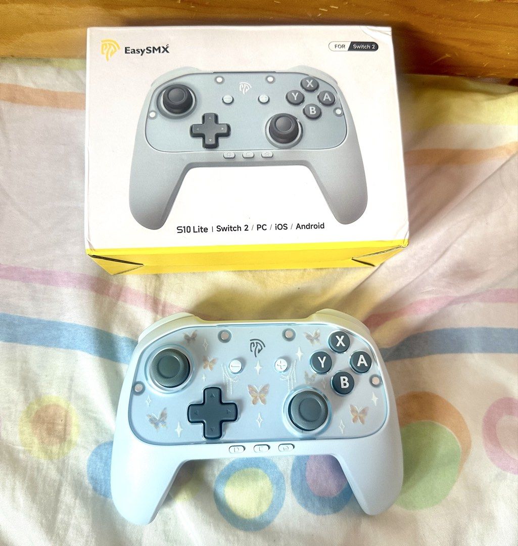 EasySMX S10 Lite Wireless Controller for Switch/PC/iOS/Android (Category: Controllers) located in Las Pinas. Submitted by starlightaurum (Listing ID 1451152960, Image 2). Description: - Cute light blue butterfly design controller - Compatible with Nintendo Switch, PC, iOS, and Android - Wireless connectivity for freedom of movement - Includes original packaging - Ideal for gaming at home or on the go - With Hall-effect.