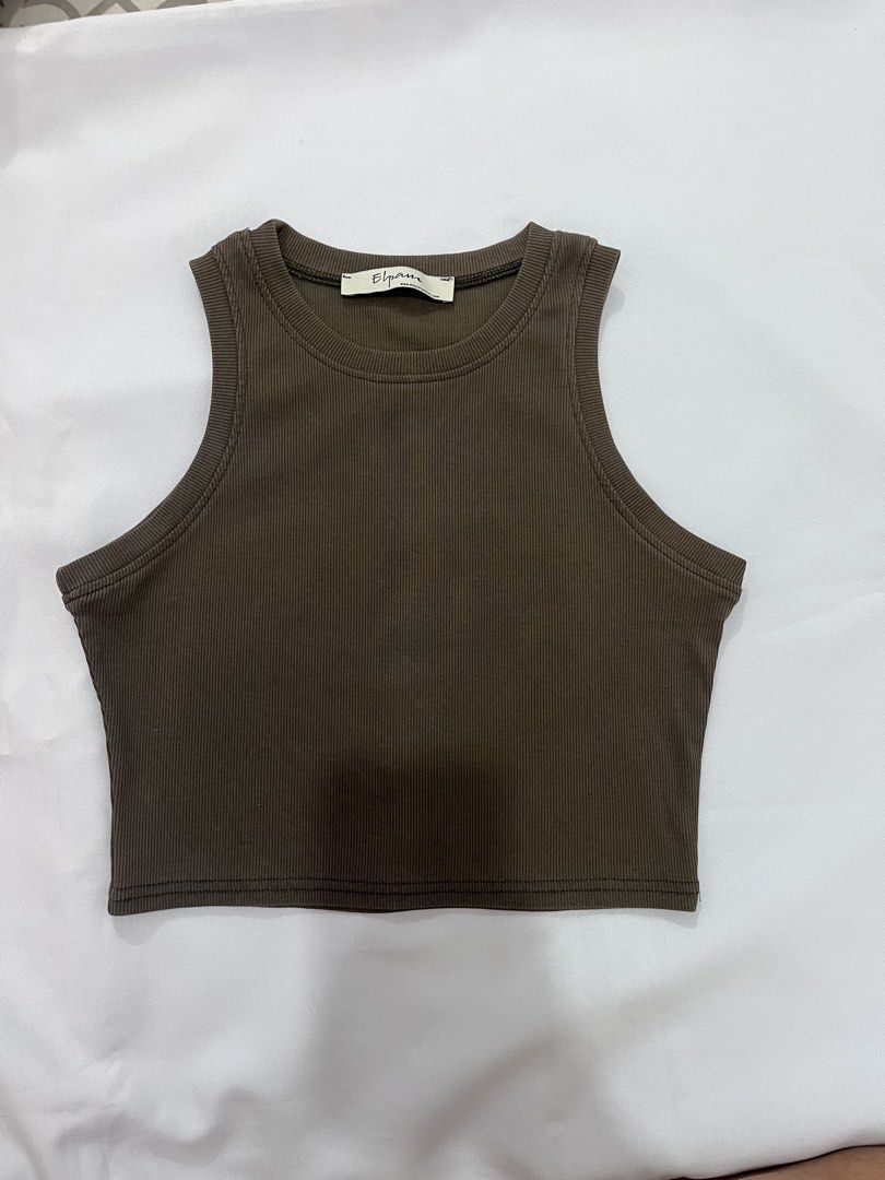 Elpam Ribbed Racerback Tank Top (Category: Sleeveless) located in Las Pinas. Submitted by _potatoee (Listing ID 1451282113, Image 1). Description: Olive green ribbed tank top from Elpam. Racerback style. Stretchy material. Great basic piece for your wardrobe..