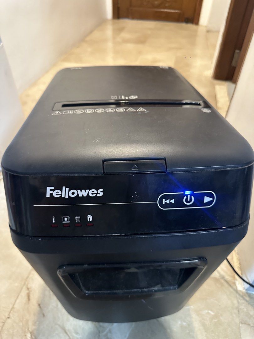 Fellowes 200C Automatic Paper Shredder (Category: Office & Business Technology) located in Paranaque City. Submitted by abiiii_ (Listing ID 1451317278, Image 1). Description: - Fellowes 200C Paper Shredder - 200 papersheets - Fully functional and works well - (issue) Minor cosmetic scratches on the side .