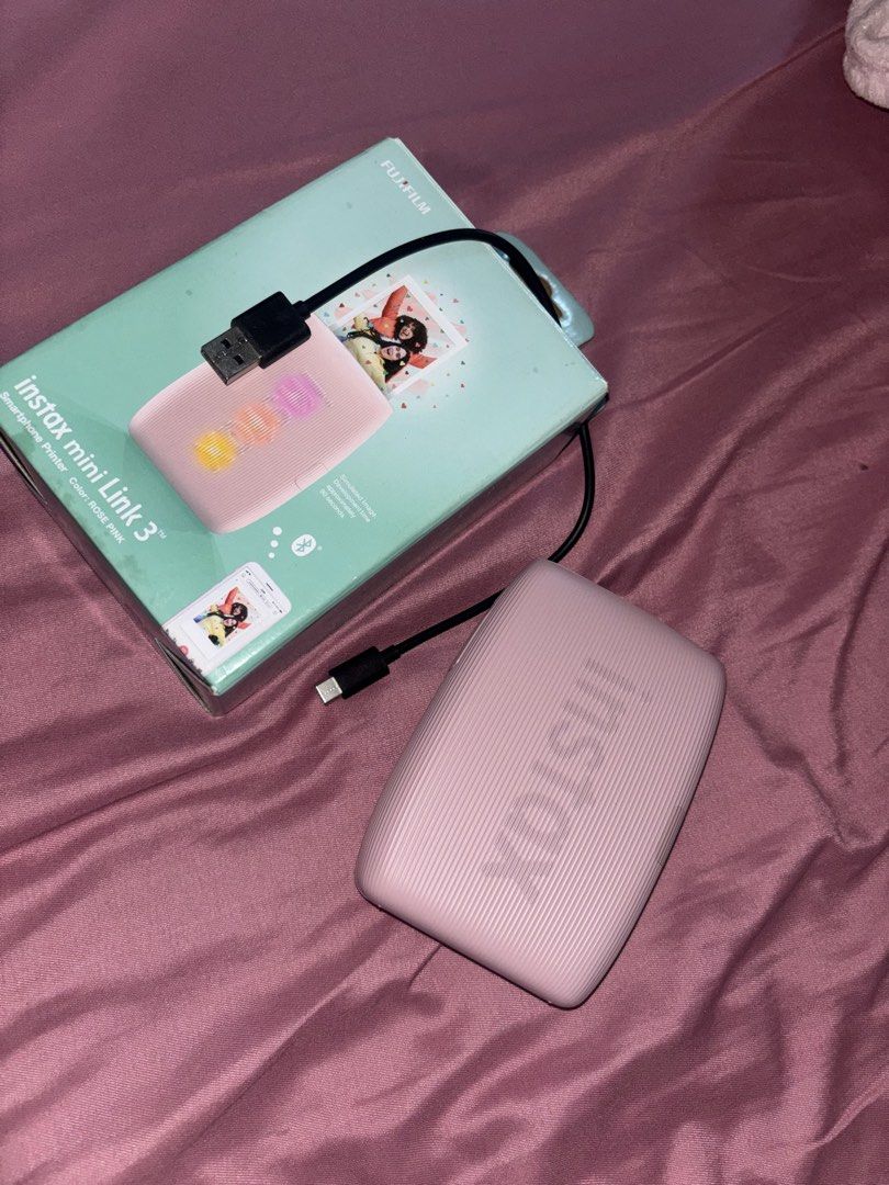 Fujifilm Instax Mini Link 3 Smartphone Printer - Rose Pink (Category: Printers, Scanners & Copiers) located in Manila. Submitted by preloved.byayana (Listing ID 1451224269, Image 1). Description: - Fujifilm Instax Mini Link 3 Printer - Color: Rose Pink - No issue - Used once, ‘di na ginagamit and nakatambak lang - Kasama the original box & charger.