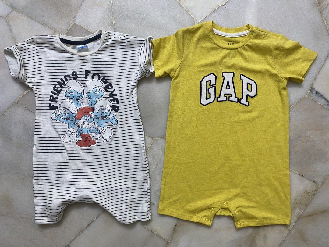 George & Gap Baby Rompers (18-24 Months) (Category: Babies & Kids Fashion) located in Klang. Submitted by syiiro (Listing ID 1451144665, Image 1). Description: - Two adorable baby rompers, perfect for your little one. - Size: 18-24 months. - Romper 1: White and blue striped George Clothing romper with a fun Smurfs print. - Romper 2: Bright yellow Gap romper. - Ideal for everyday wear and comfortable play..