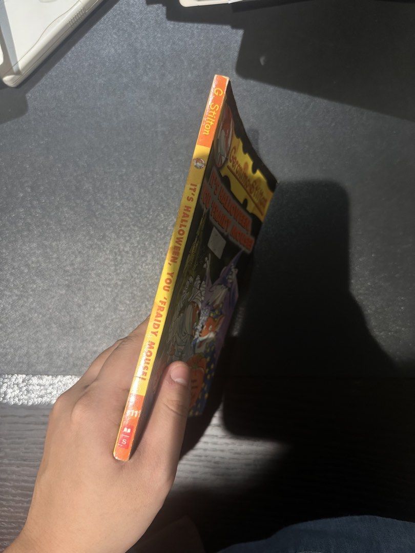 Geronimo Stilton: It's Halloween, You 'Fraidy Mouse! (Category: Children's Books) located in Quezon City. Submitted by kl.secondhand (Listing ID 1451312185, Image 2). Description: - Geronimo Stilton: 'It's Halloween, You 'Fraidy Mouse!' book - Features Geronimo and his nephew Benjamin on a Halloween adventure - Includes 30 pages of Halloween games and costume ideas - Ideal for young readers who enjoy spooky stories - Published by Scholastic.