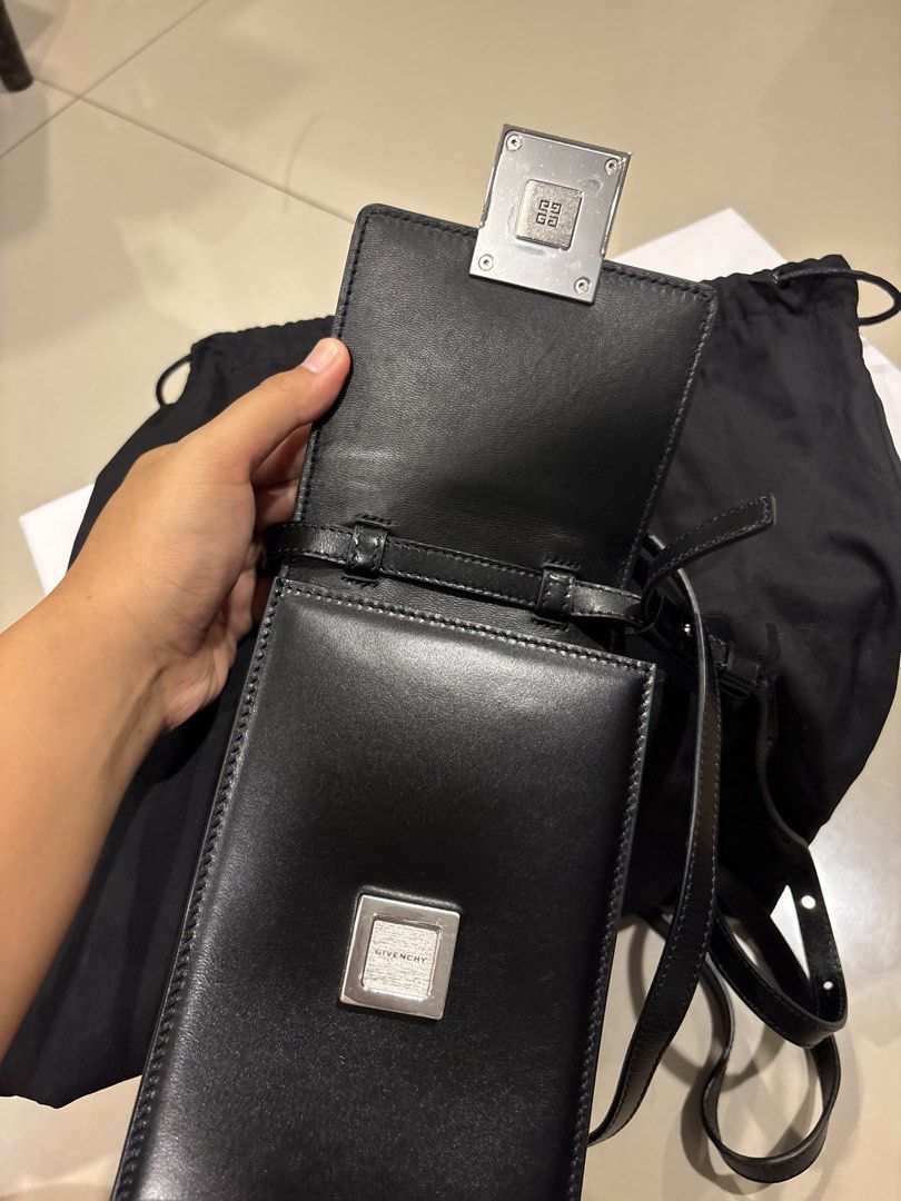 Givenchy 4G Mini Vertical Crossbody Bag Black Leather (Category: Luxury Bags & Wallets) located in Manila. Submitted by paulineeguzman2 (Listing ID 1451258982, Image 3). Description: - Authentic Givenchy 4G Mini Vertical Crossbody bag - Color: Black leather - Hardware: Silver - Includes: Dust bag - Features: Adjustable strap - Ideal for: Carrying essentials.