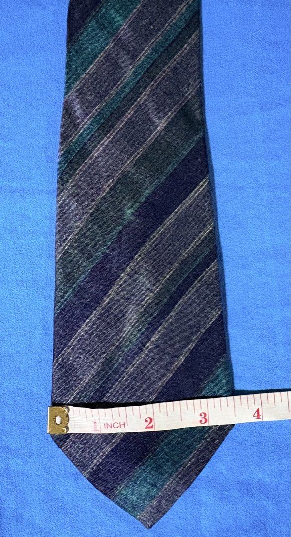GIVENCHY GENTLEMAN PARIS Tie Made in Italy (Category: Ties) located in Manila. Submitted by truedeclutter (Listing ID 1451196247, Image 2). Description: - Classic diagonal stripe tie - Brand: GIVENCHY GENTLEMAN PARIS - Made in Italy - Colors: Navy, green, and grey stripes - Fabric: Subtle texture - Needs ironing - Ideal for: Formal or business wear.
