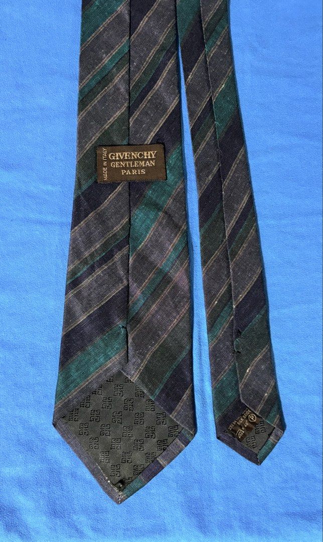 GIVENCHY GENTLEMAN PARIS Tie Made in Italy (Category: Ties) located in Manila. Submitted by truedeclutter (Listing ID 1451196247, Image 3). Description: - Classic diagonal stripe tie - Brand: GIVENCHY GENTLEMAN PARIS - Made in Italy - Colors: Navy, green, and grey stripes - Fabric: Subtle texture - Needs ironing - Ideal for: Formal or business wear.