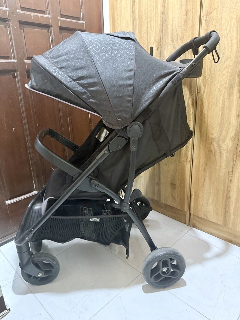 Graco Nimblelite Stroller (Category: Strollers) located in Muntinlupa City. Submitted by kyp_closet (Listing ID 1451287959, Image 3). Description: Bought from Amazon US Still in good working condition Lightweight Stroller, Under 15 Pounds, Car Seat Compatible, Compact Fold See link below for more product details: https://a.co/d/0fFD1ZrJ -Graco stroller in black with a stylish patterned canopy. - Convenient storage basket underneath for essentials