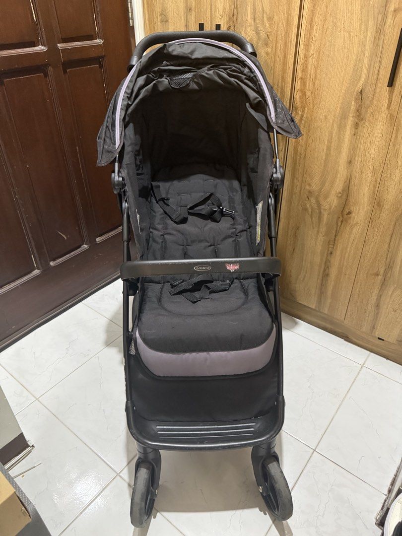 Graco Nimblelite Stroller (Category: Strollers) located in Muntinlupa City. Submitted by kyp_closet (Listing ID 1451287959, Image 2). Description: Bought from Amazon US Still in good working condition Lightweight Stroller, Under 15 Pounds, Car Seat Compatible, Compact Fold See link below for more product details: https://a.co/d/0fFD1ZrJ -Graco stroller in black with a stylish patterned canopy. - Convenient storage basket underneath for essentials