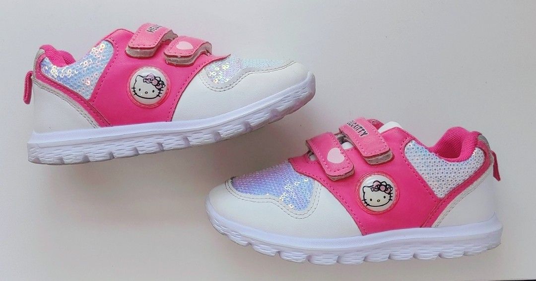 Hello Kitty Pink/White Sequined Velcro Sneakers (Category: Babies & Kids Fashion) located in Las Pinas. Submitted by thechaptermarketph (Listing ID 1451177742, Image 3). Description: - Adorable bright pink/white Hello Kitty sneakers for kids. - Pre-loved but in excellent condition - Features eye-catching sparkly sequin details on the front. - Convenient velcro straps for easy on and off. - Ideal for everyday wear, school, or casual occasions. RFS
