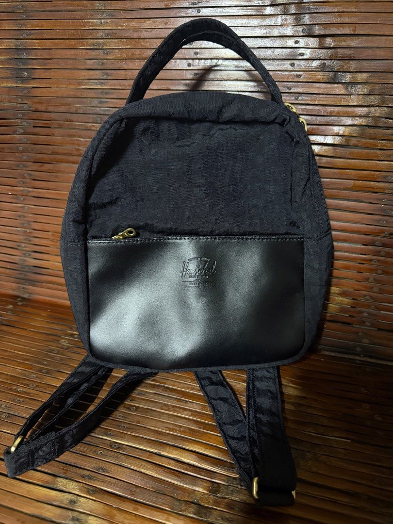 Herschel Mini Orion Backpack (Category: Backpacks) located in Manila. Submitted by tonrgsp_ (Listing ID 1451168401, Image 1). Description: - Black Herschel mini backpack - Size: 9.25" (H) x 8" (W) x 3.75" (D) - Can fit long wallet - Adjustable shoulder straps - Top handle for easy carrying - Compact and ideal for everyday use or travel - Used 5x, good as new.