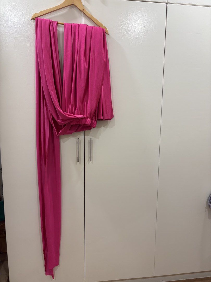 Hot Pink Infinity Dress Gown (Category: Dresses) located in Paranaque City. Submitted by macabelli (Listing ID 1451245360, Image 3). Description: - Vibrant hot pink infinity dress / gown - Can be styled many ways - Ideal for events, weddings, debut, and parties - One size fits most due to adjustable wrap style - Selling as it's no longer needed.