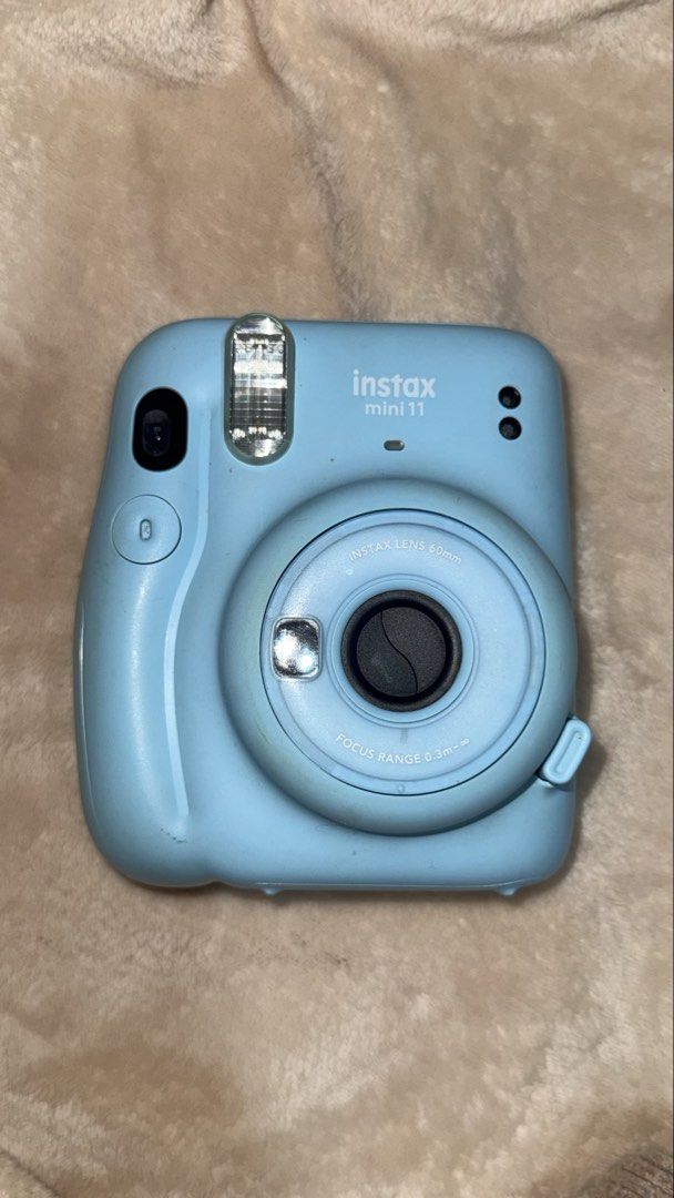 Instax mini 11 (Category: Cameras) located in Baguio. Submitted by linebylienne (Listing ID 1451201294, Image 1). Description: Working Minor yellowish stains Rfs: i need fund to ug Loaded with alkaline battery Price still negotiable Will try to find pa the orig box and strap.