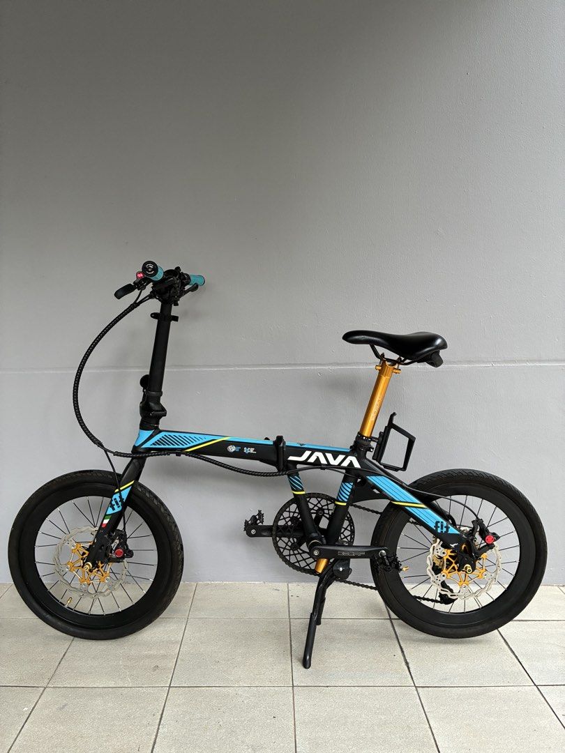 JAVA Foldable Bicycle (Category: Bicycles) located in Singapore. Submitted by soars321 (Listing ID 1451182016, Image 1). Description: - JAVA folding bike - 16-inch wheels - Reliable disc brakes - Stylish gold accents on hubs and seat post - Lightweight and easy to fold - Ideal for commuting and casual rides - Comes with hydraulic brakes - Price able to negotiate - Ready for a new owner .