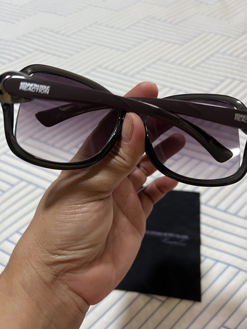 Kenneth Cole Reaction Sunglasses with Case and Pouch (Category: Sunglasses & Eyewear) located in Quezon City. Submitted by daday39 (Listing ID 1451130171, Image 2). Description: - Kenneth Cole Reaction sunglasses - Dark brown frames with subtle tortoise shell pattern on arms - Gradient lenses - Includes original hard case and soft pouch - Ideal for everyday wear Authentic .