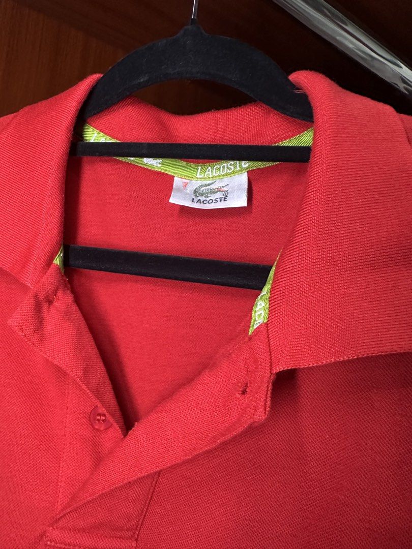 Lacoste Red Polo Shirt (Category: Tshirts & Polo Shirts ) located in Calamba. Submitted by treb_c (Listing ID 1451132656, Image 3). Description: - Classic red Lacoste polo shirt - Short sleeves with ribbed cuffs - Two-button placket - Iconic Lacoste crocodile logo on chest - Versatile for casual or sporty looks - Pairs well with jeans or shorts.