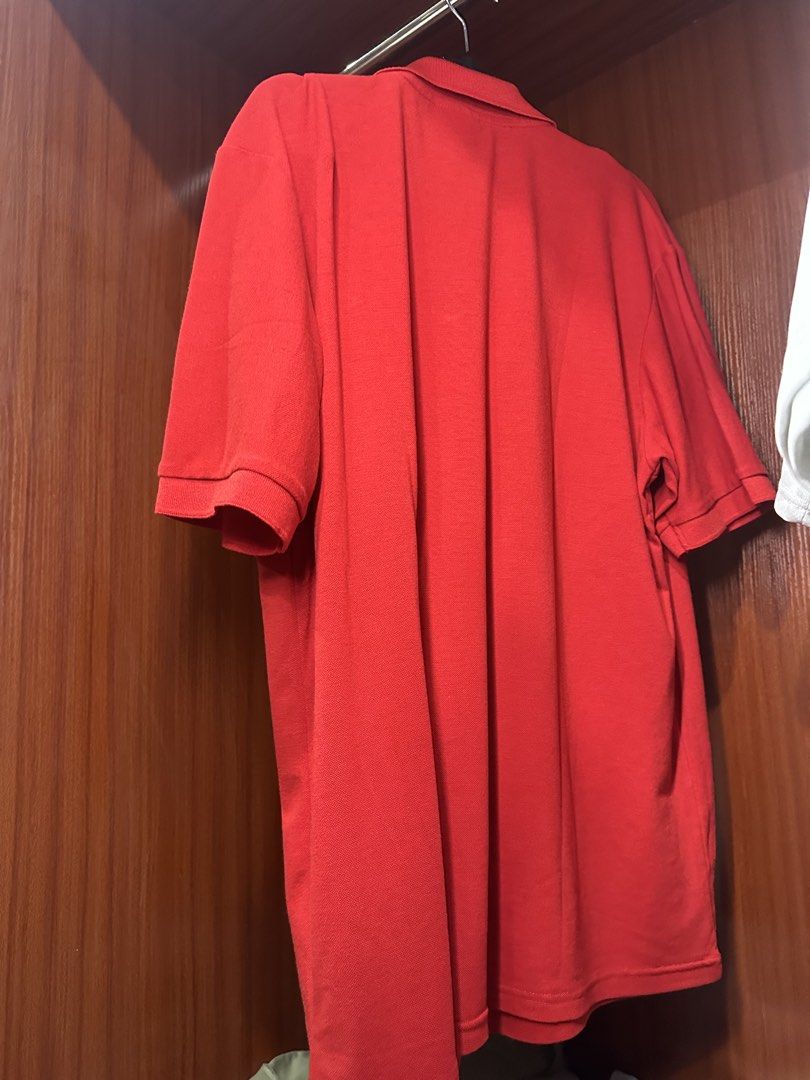 Lacoste Red Polo Shirt (Category: Tshirts & Polo Shirts ) located in Calamba. Submitted by treb_c (Listing ID 1451132656, Image 2). Description: - Classic red Lacoste polo shirt - Short sleeves with ribbed cuffs - Two-button placket - Iconic Lacoste crocodile logo on chest - Versatile for casual or sporty looks - Pairs well with jeans or shorts.