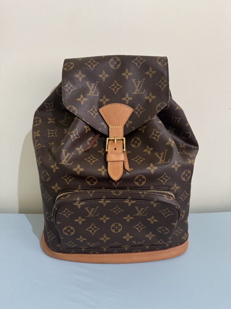 Authentic Louis Vuitton Montsouris Backpack, GM size (great condition) (Category: Luxury Bags & Wallets) located in Pasig City. Submitted by topbrandpursuits (Listing ID 1451215594, Image 1). Description: - Classic Louis Vuitton Montsouris GM backpack in great condition - Can fit laptop - Rank 9.9/10 used once or twice only) - Iconic monogram canvas with LV print - Tan leather trim - Secure drawstring closure with buckle flap - Convenient front z