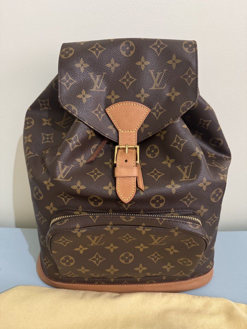 Authentic Louis Vuitton Montsouris Backpack, GM size (great condition) (Category: Luxury Bags & Wallets) located in Pasig City. Submitted by topbrandpursuits (Listing ID 1451215594, Image 3). Description: - Classic Louis Vuitton Montsouris GM backpack in great condition - Can fit laptop - Rank 9.9/10 used once or twice only) - Iconic monogram canvas with LV print - Tan leather trim - Secure drawstring closure with buckle flap - Convenient front z