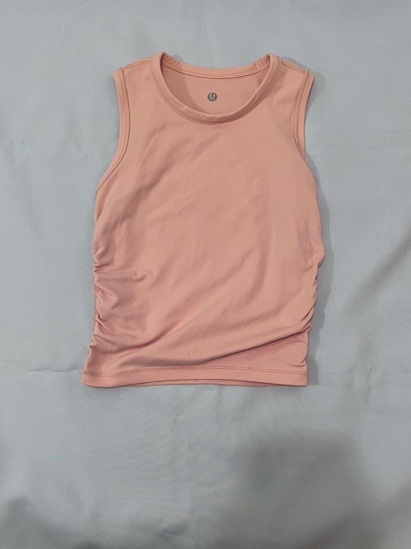 Lululemon Pink Ruched Tank Top (Category: Sleeveless) located in Las Pinas. Submitted by _potatoee (Listing ID 1451281412, Image 1). Description: - Pink Lululemon tank top - Sleeveless design - Ruching detail on the sides - Comfortable and breathable fabric.