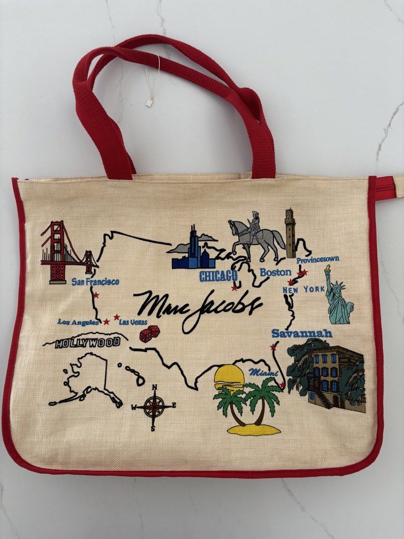 Marc Jacobs USA Map Tote Bag (Category: Luxury Bags & Wallets) located in Muntinlupa City. Submitted by nicethingsforsale1 (Listing ID 1451150399, Image 1). Description: - Authentic Marc Jacobs tote bag - Unique USA map design with embroidered landmarks (San Francisco, Chicago, New York, Miami) - Made from natural jute material - Accented with red trim and handles - Spacious and ideal for travel or everyday essentials.