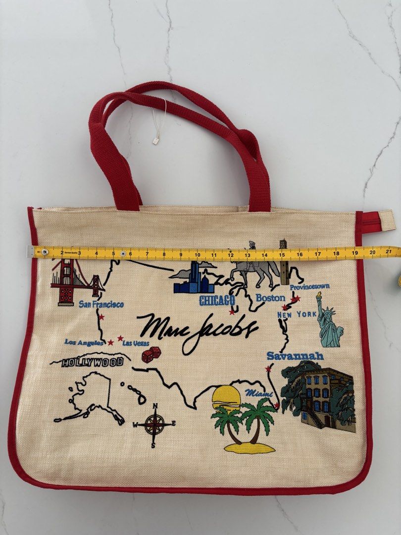 Marc Jacobs USA Map Tote Bag (Category: Luxury Bags & Wallets) located in Muntinlupa City. Submitted by nicethingsforsale1 (Listing ID 1451150399, Image 3). Description: - Authentic Marc Jacobs tote bag - Unique USA map design with embroidered landmarks (San Francisco, Chicago, New York, Miami) - Made from natural jute material - Accented with red trim and handles - Spacious and ideal for travel or everyday essentials.