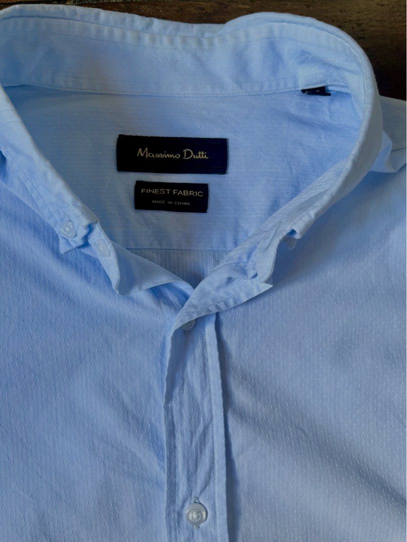 Massimo Dutti Light Blue Button-Down Shirt w/ Navy Elbow Patches (Category: Formal Shirts) located in Lipa City. Submitted by coolthreadss (Listing ID 1450813228, Image 3). Description: Brand: Massimo Dutti Color: Light Blue / Sky Blue (with Navy Elbow Patches) Style: Long-sleeve button-down shirt Features: Distinctive elbow patch accents, button-down collar, textured fabric woven finish Condition: Pre-owned in great condition. (Clean fabric with