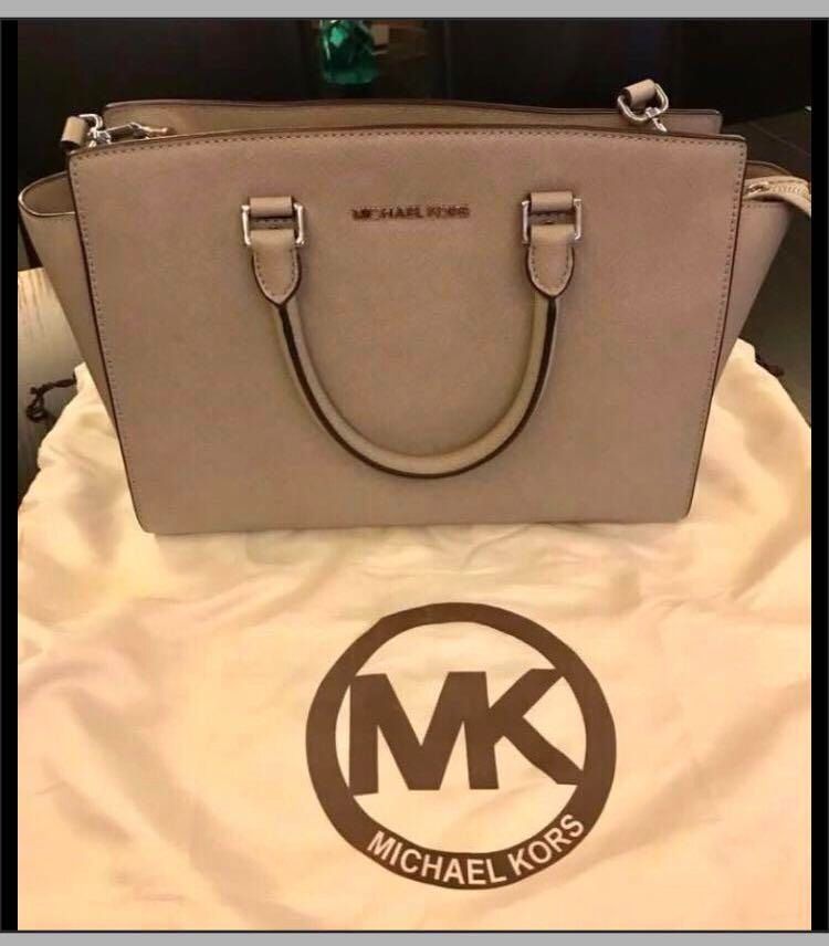 MICHAEL KORS GRAY SELMA BAG (Category: Luxury Bags & Wallets) located in Makati City. Submitted by seriousdeclutteringmission (Listing ID 1451134011, Image 1). Description: Authentic Michael Kors Gray Selma Bag Purchased in MK Edsa Shangri La (receipt available for viewing upon request) May be hand-carried or shoulder bag (comes with detachable long strap) Comes with dustbag..