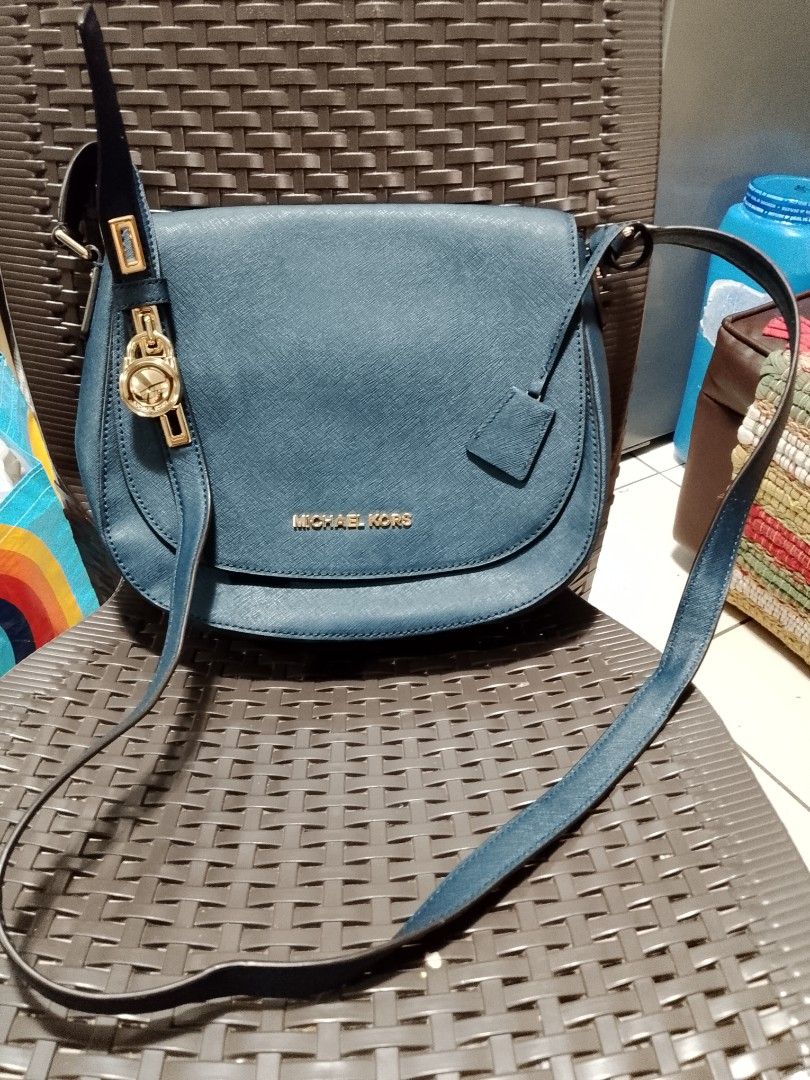 Michael Kors Teal Leather Shoulder Bag (Category: Luxury Bags & Wallets) located in Manila. Submitted by batchi1019 (Listing ID 1451269772, Image 1). Description: - Authentic Michael Kors teal leather shoulder bag - Elegant gold hardware details - Spacious main compartment with an interior zip pocket - Adjustable strap for comfortable wear - Comes with original care card - Ideal for everyday style and practicality.